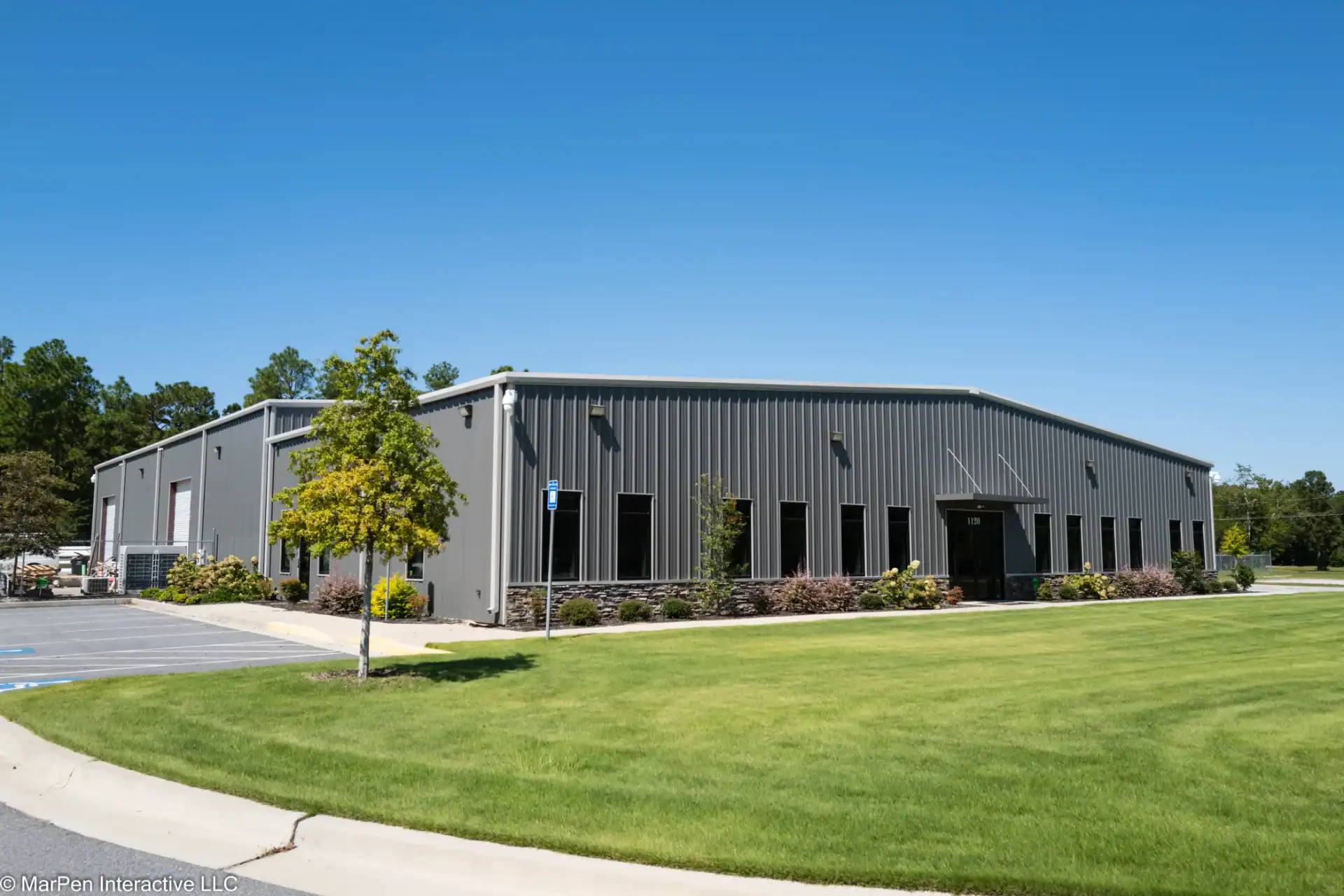Pre-engineered commercial steel building with glass storefront