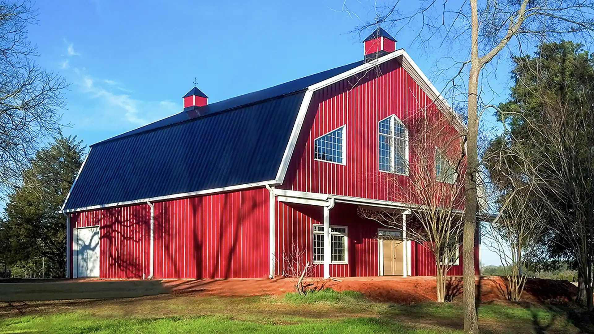 Large clear-span agricultural steel building with sliding doors
